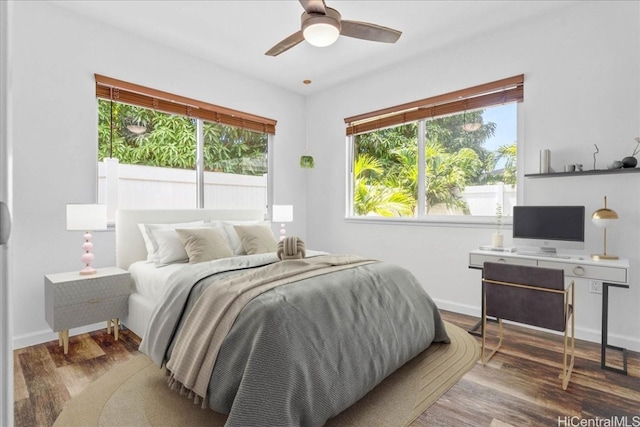 bedroom with hardwood / wood-style flooring and ceiling fan