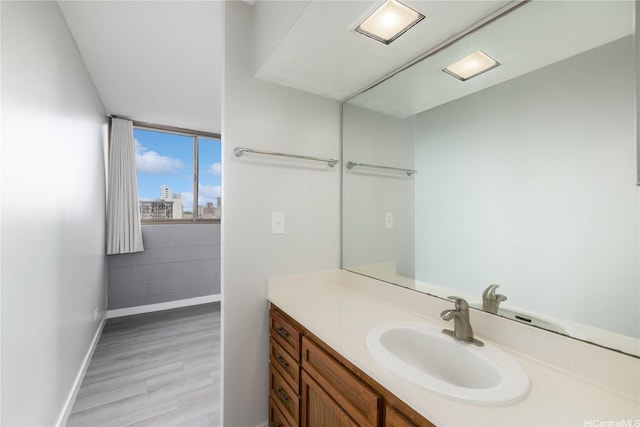 1040 Kinau St Unit 803, Honolulu, HI 96814 - bathroom featuring vanity, wood finished floors, and baseboards