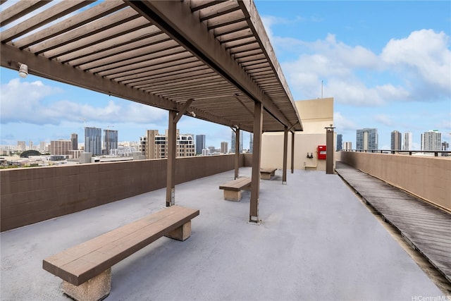 view of patio / terrace with a pergola and a city view