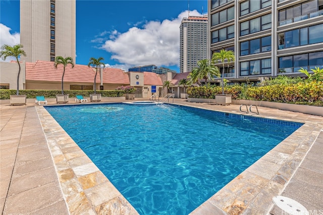 view of swimming pool with a patio