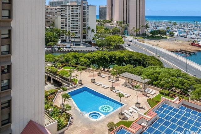 bird's eye view featuring a water view and a city view