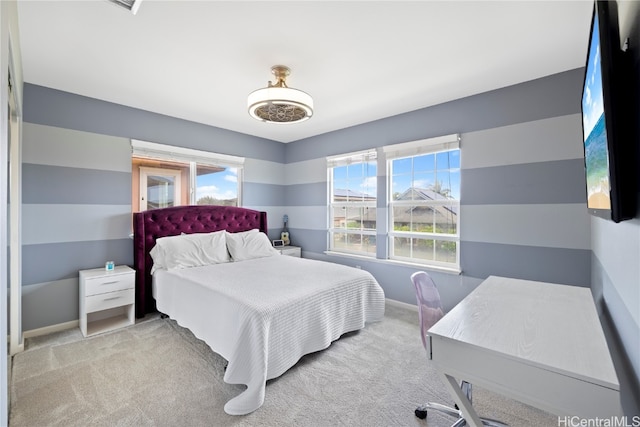 bedroom with light colored carpet