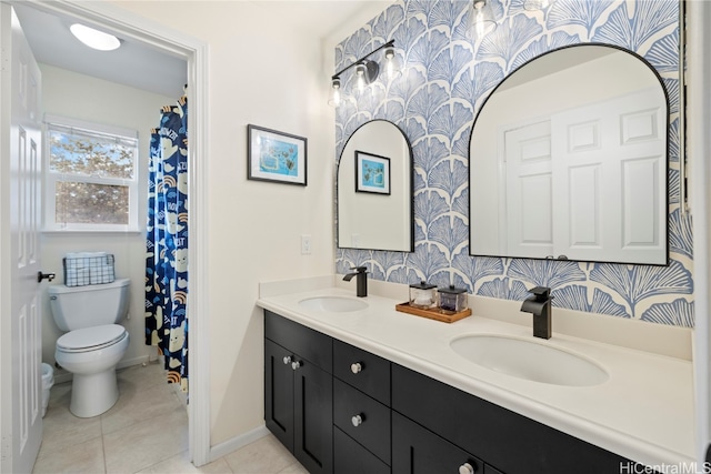 bathroom featuring vanity, toilet, and tile patterned floors