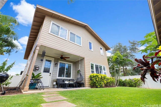 view of front of home featuring a patio area, a front lawn, and ceiling fan