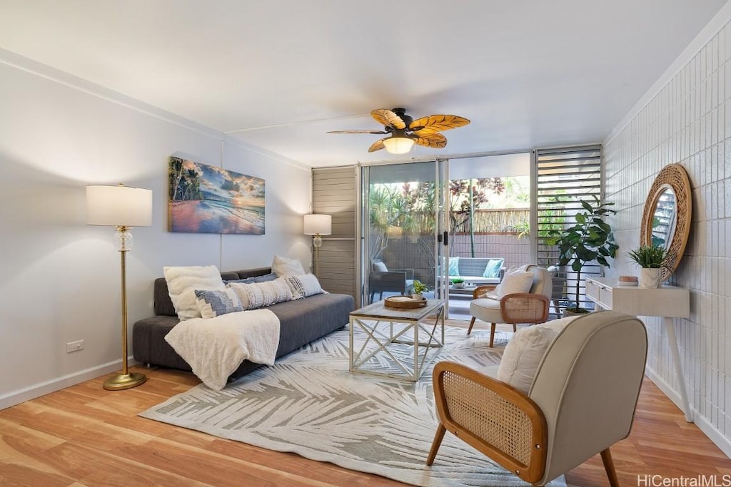 bedroom featuring access to exterior, hardwood / wood-style flooring, ceiling fan, and ornamental molding