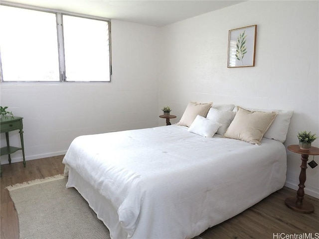 bedroom with hardwood / wood-style floors