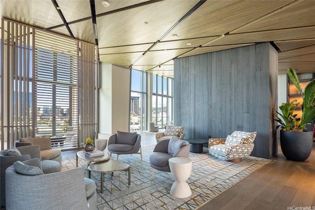 common area with floor to ceiling windows and a towering ceiling