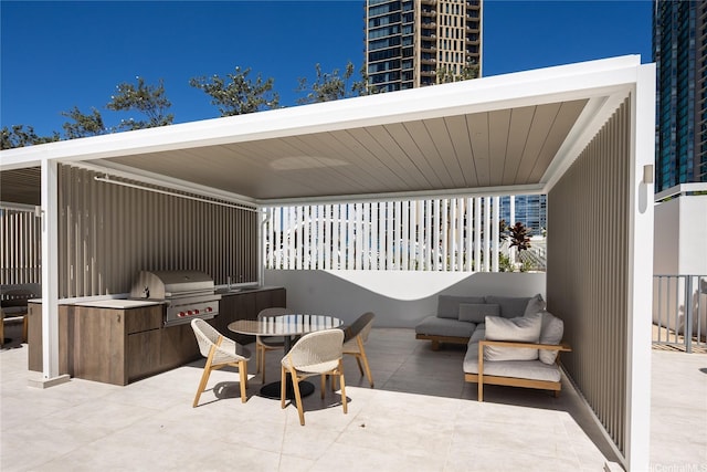 view of patio with area for grilling and an outdoor kitchen