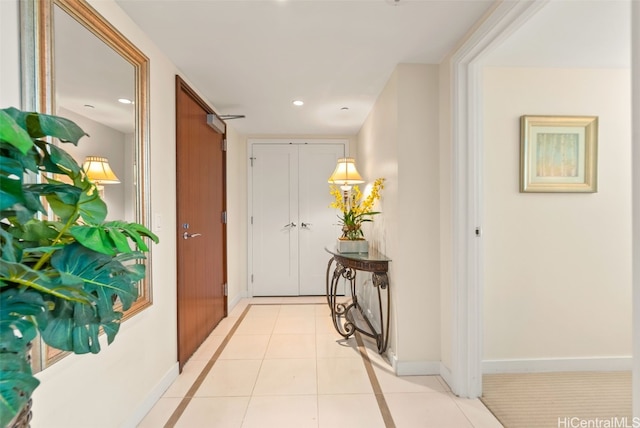 hallway with light tile patterned floors