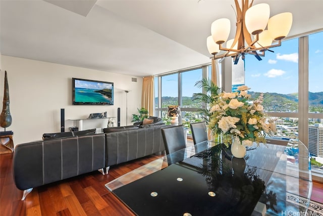 interior space featuring a notable chandelier, dark hardwood / wood-style floors, and expansive windows