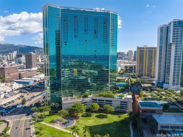 property's view of city with a mountain view