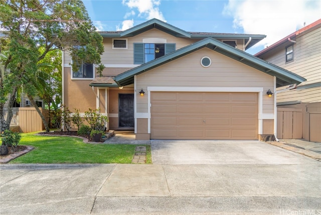 view of front facade with a garage, concrete driveway, a front yard, and fence