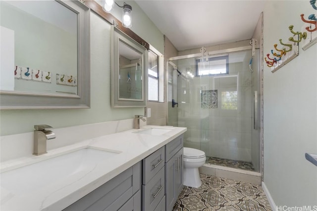 full bathroom featuring tile patterned flooring, a sink, toilet, and double vanity