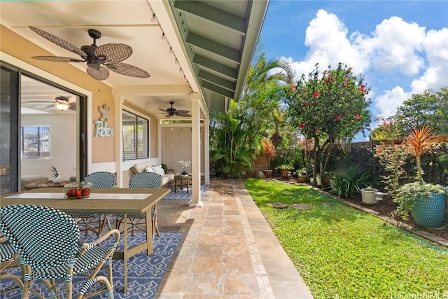 view of patio / terrace with outdoor dining space, a fenced backyard, and ceiling fan