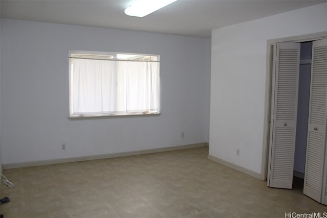 unfurnished bedroom with a closet