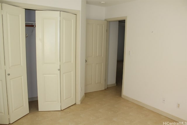 unfurnished bedroom with a closet