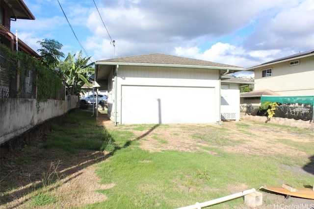 view of side of property with a garage