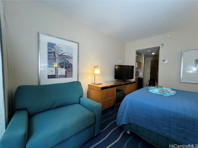 bedroom with dark colored carpet