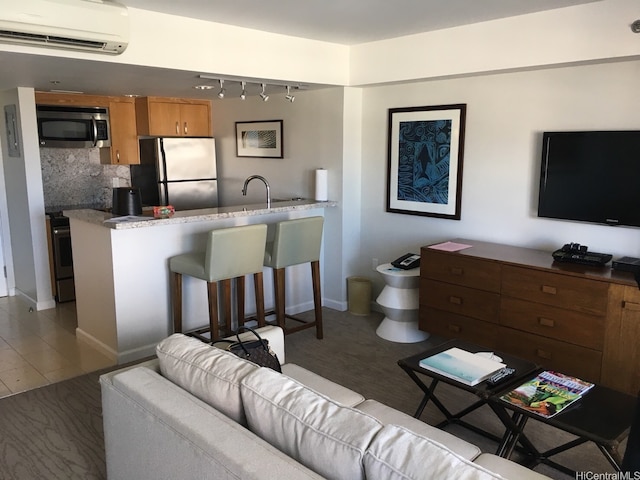 1777 Ala Moana Blvd Unit 2218, Honolulu, HI 96815 - living area featuring track lighting and a wall unit AC