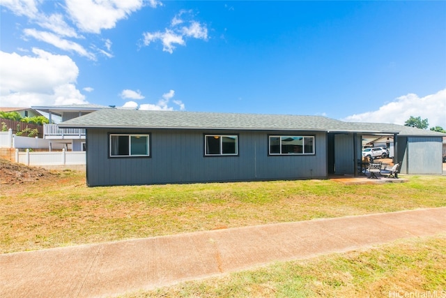 view of side of home featuring a yard