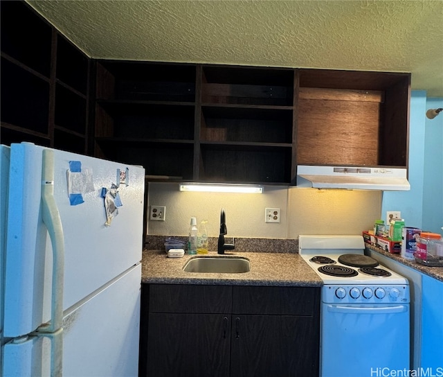 kitchen with white appliances, a textured ceiling, and sink