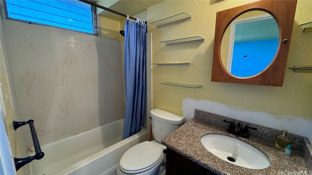 full bathroom featuring vanity, shower / bath combo with shower curtain, and toilet