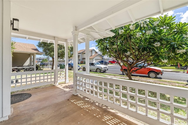 view of patio with a residential view and a porch