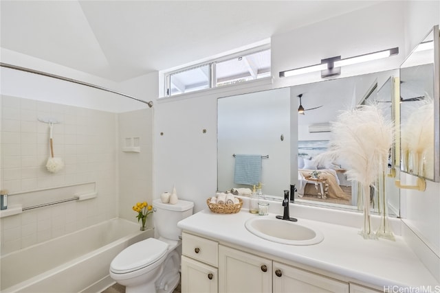 full bathroom with vanity, toilet, and tiled shower / bath combo