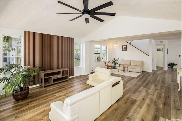 91-1019 Hiluhilu St, Kapolei, HI 96707 - living area featuring a ceiling fan, wood finished floors, stairs, cooling unit, and high vaulted ceiling