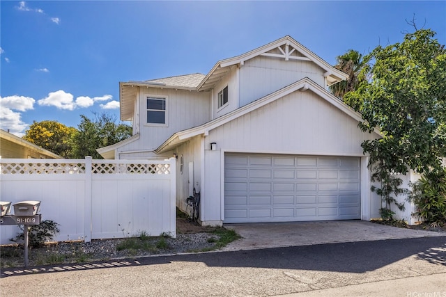91-1019 Hiluhilu St, Kapolei, HI 96707 - traditional-style house featuring fence, driveway, and a garage