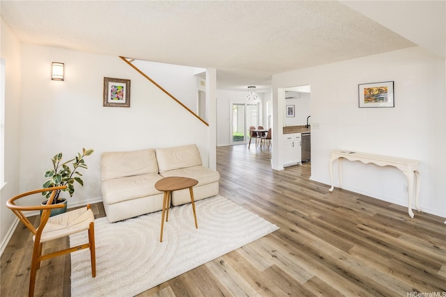 91-1019 Hiluhilu St, Kapolei, HI 96707 - living area with light wood-style flooring and baseboards