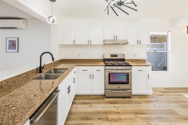 91-1019 Hiluhilu St, Kapolei, HI 96707 - kitchen with appliances with stainless steel finishes, under cabinet range hood, a wall mounted AC, a sink, and light wood-style floors