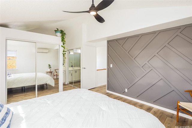 91-1019 Hiluhilu St, Kapolei, HI 96707 - bedroom featuring wood finished floors, a ceiling fan, a closet, a wall mounted air conditioner, and high vaulted ceiling