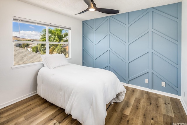 91-1019 Hiluhilu St, Kapolei, HI 96707 - bedroom featuring baseboards, wood finished floors, and ceiling fan