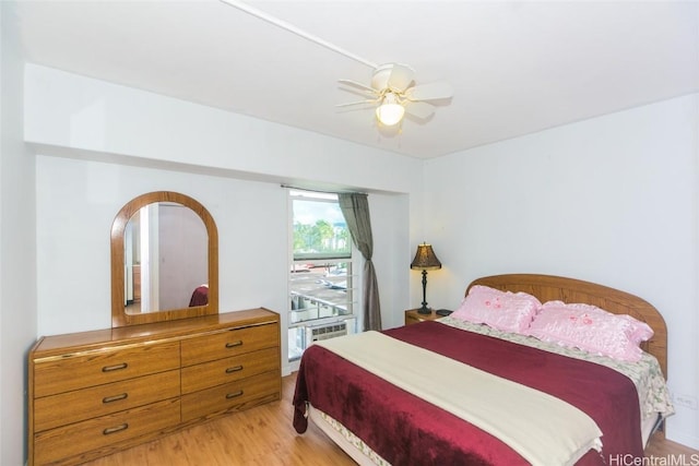 bedroom with light wood-type flooring and ceiling fan