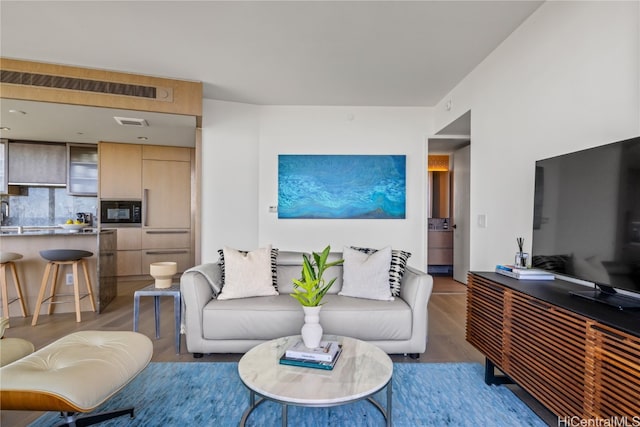 living room with hardwood / wood-style floors