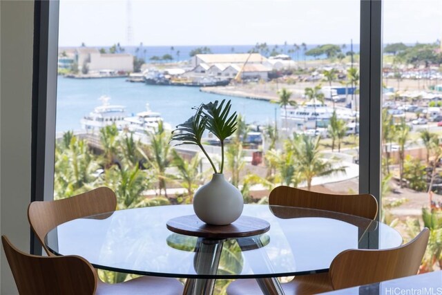 dining area featuring a water view and plenty of natural light