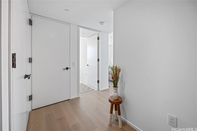 corridor featuring light wood-type flooring