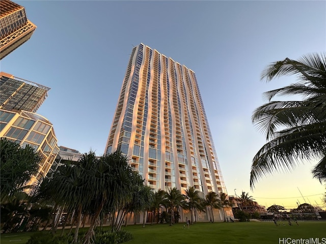 view of outdoor building at dusk