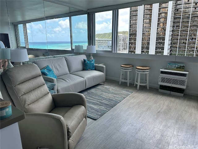 sunroom featuring a water view