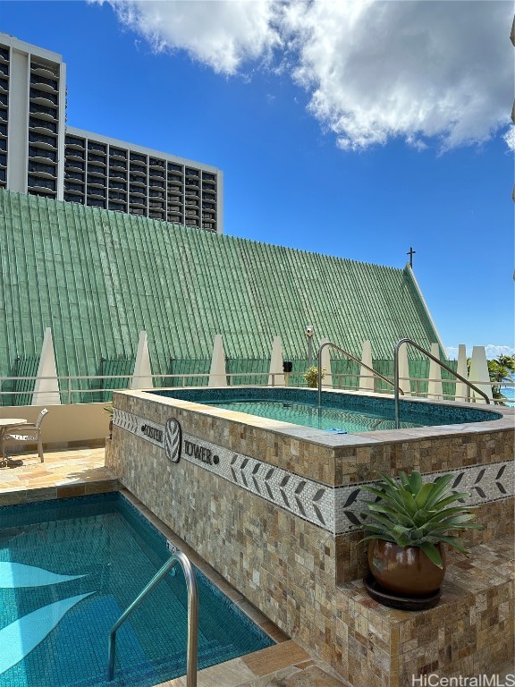 view of swimming pool with a patio area