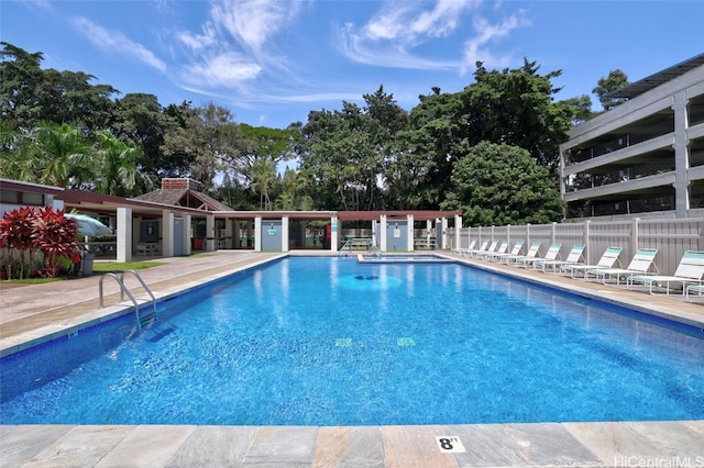 view of swimming pool with a patio area