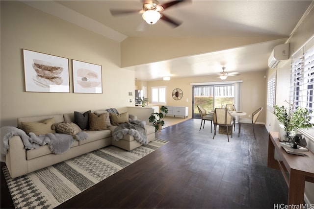 living room with a wall mounted AC, ceiling fan, wood-type flooring, and vaulted ceiling