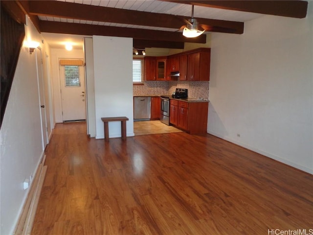 kitchen featuring tasteful backsplash, beamed ceiling, light wood-type flooring, and electric stove