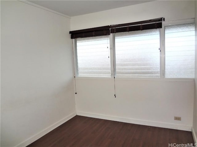 spare room featuring dark hardwood / wood-style floors