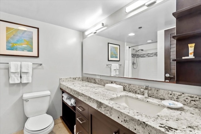 bathroom with vanity, toilet, a shower with curtain, and tile patterned flooring