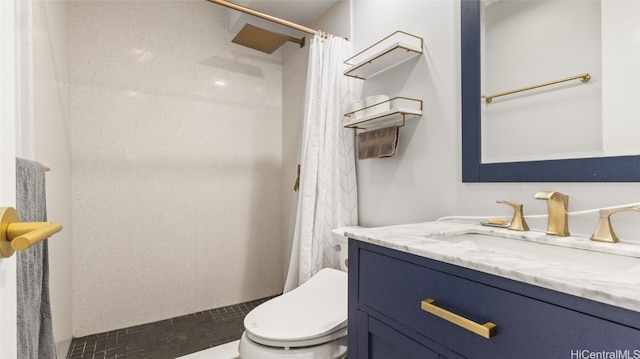 bathroom featuring vanity, toilet, and a shower with curtain