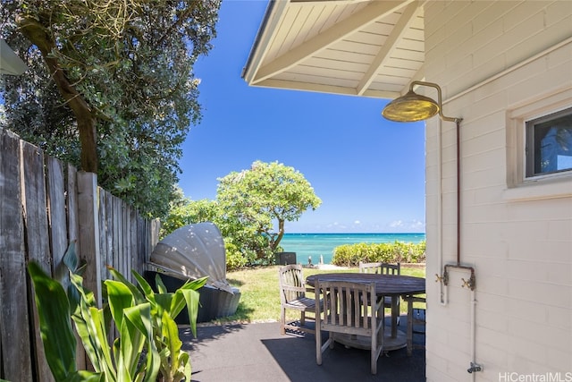 view of patio / terrace with a water view