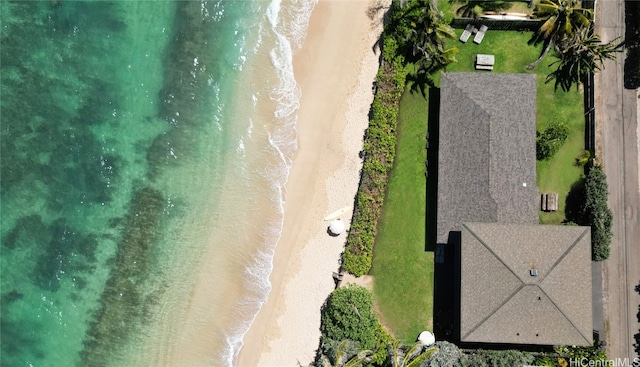 drone / aerial view featuring a water view and a beach view