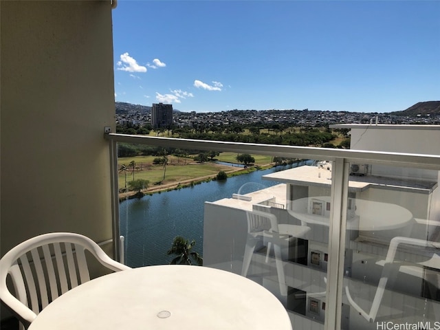 balcony featuring a water view